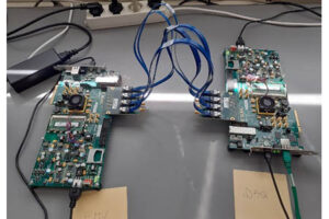 Phase 2 CLB test system for KM3: FW and implementation support