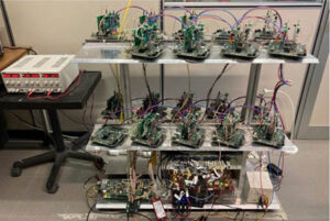 Phase 2 CLB test system for KM3: FW and implementation support